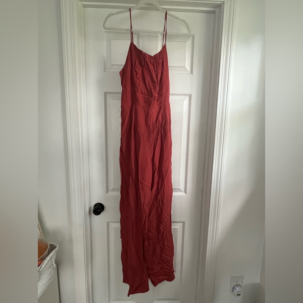 Rust colored jumpsuit, open sides on pants